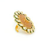 Gold Kundan Ring With Centered Embedded White Stones around Kundan and Red Carvings